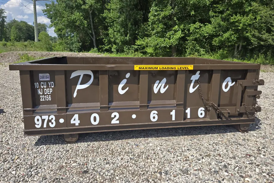 A Pinto of Montville 10-yard roll-off dumpster, seen from the side